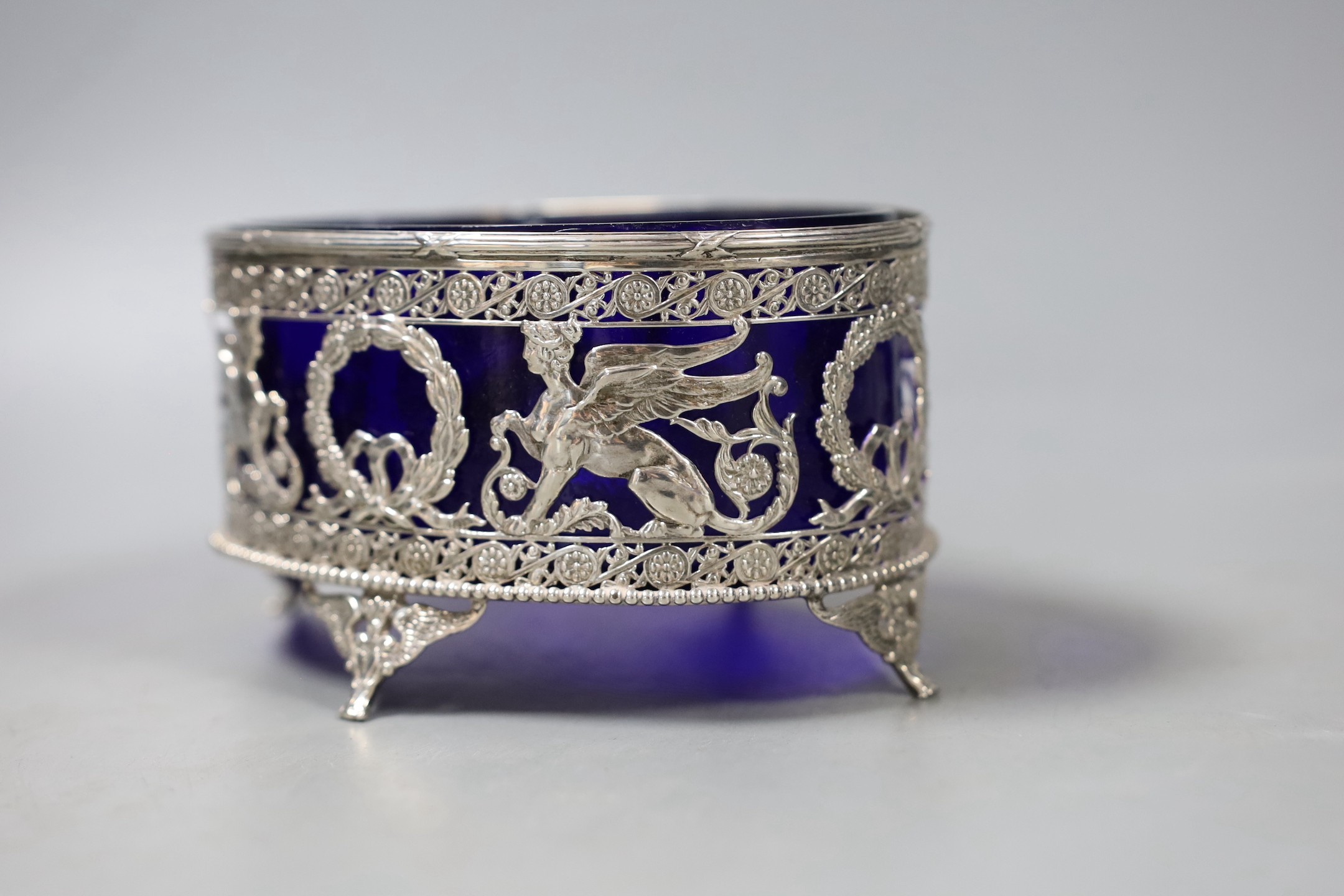 An early 20th century Hanau pierced silver oval bowl, with blue glass liner, import marks for London, 1906, 13.2cm.